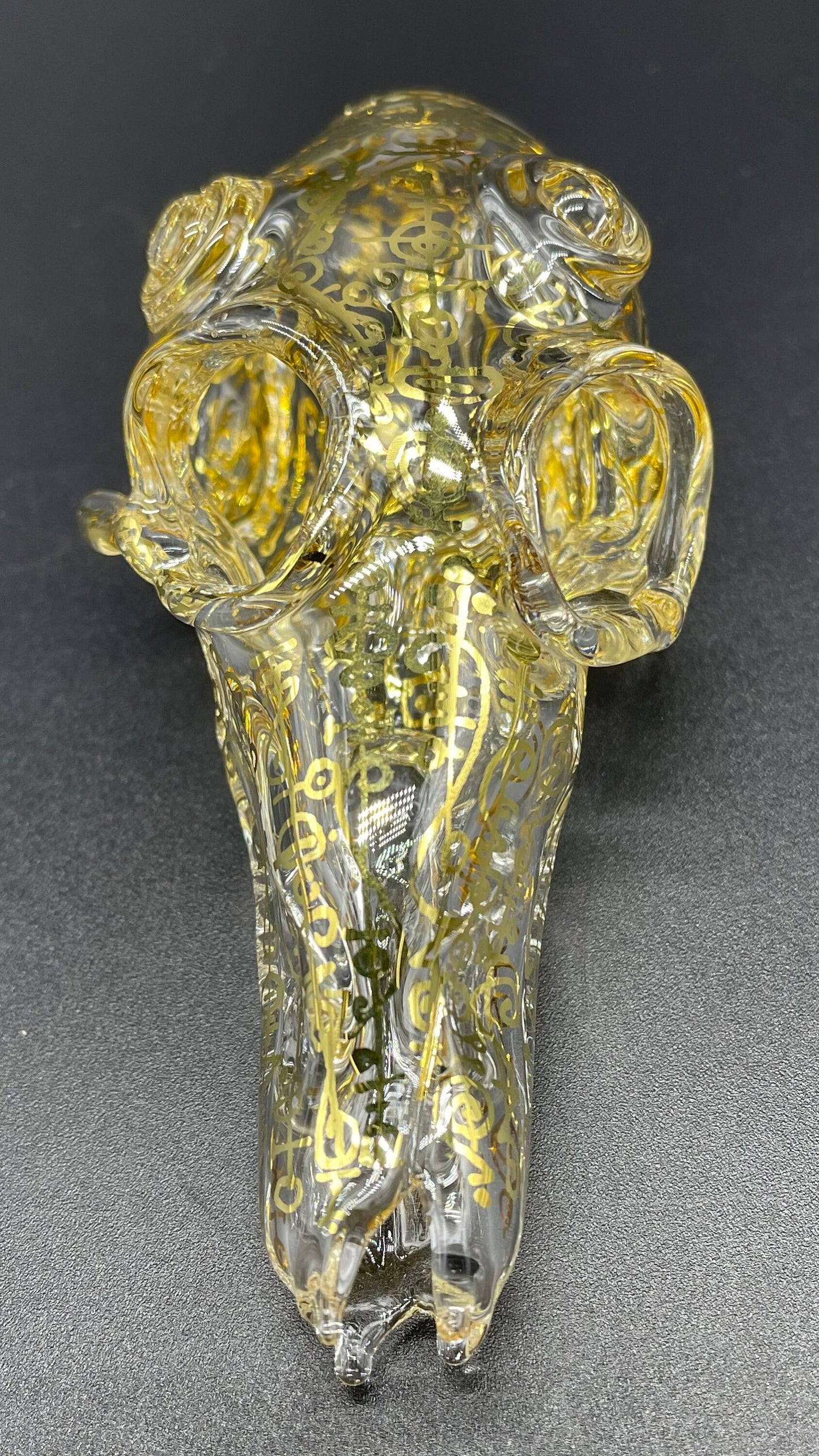 Close-up of Mystical Gold rune skull - handcrafted glass