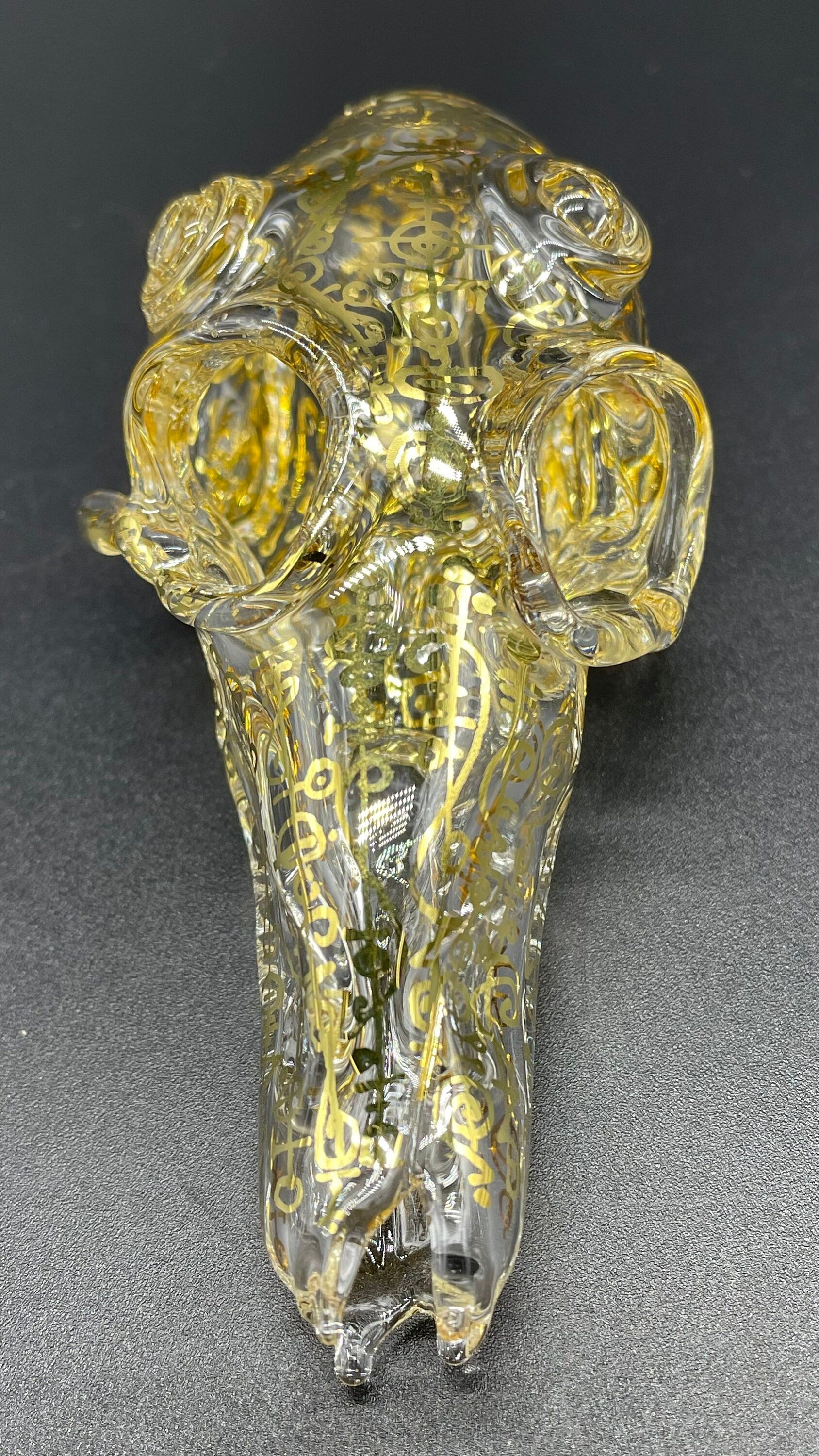 Close-up of Mystical Gold rune skull - handcrafted glass