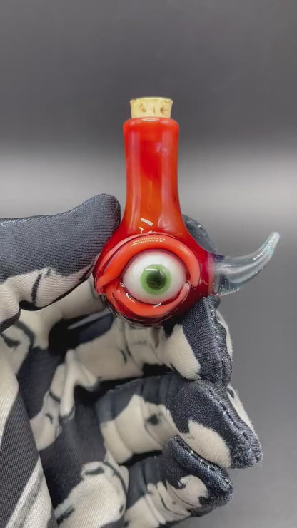 Red over white cyclops potion bottle